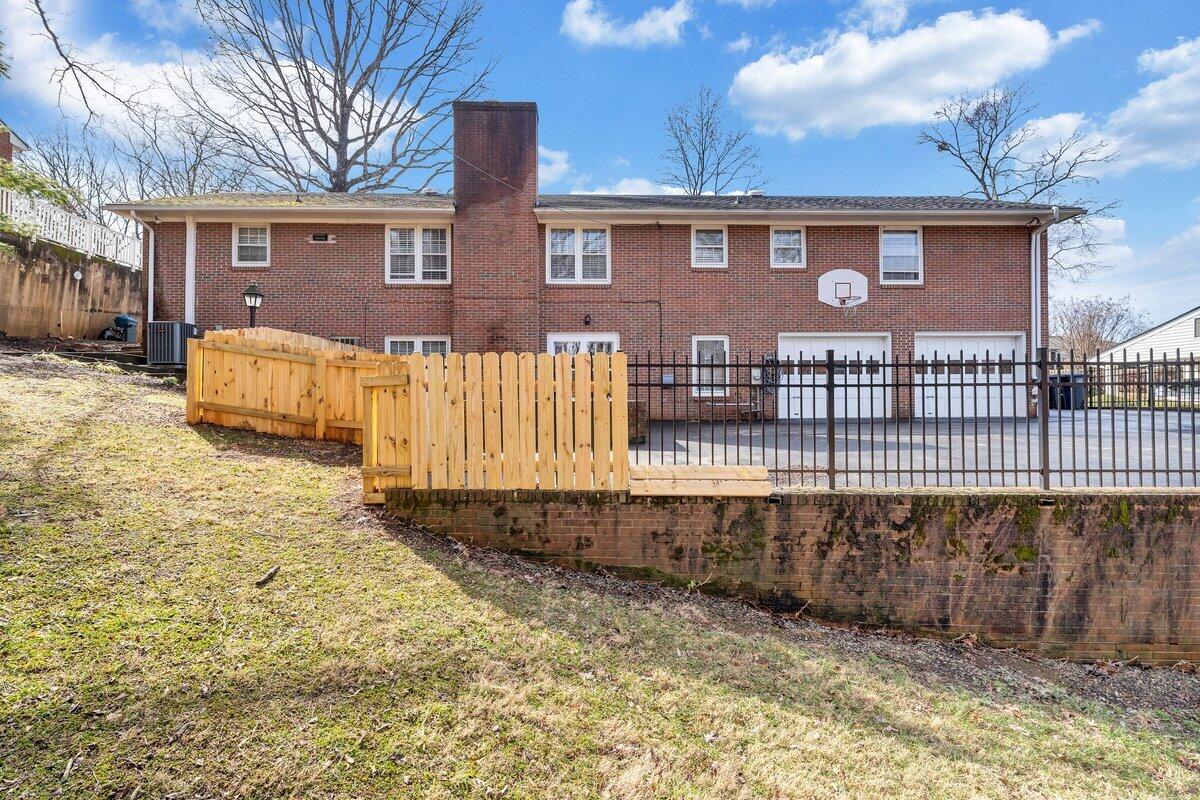 501 Darwin Road Southwest Roanoke, VA 24014 - Photo 7 of 37 a front view of a house with a yard