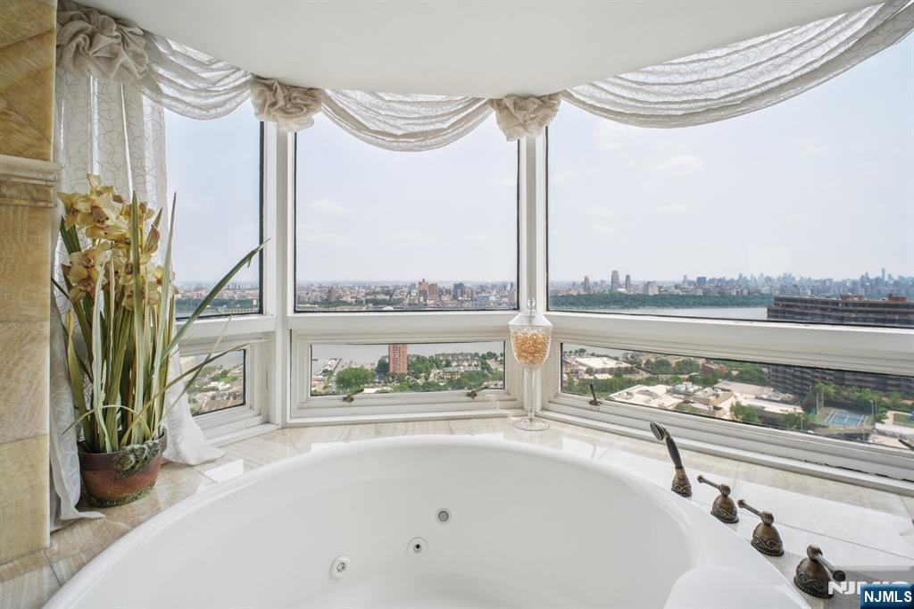 800 Palisade Avenue, Unit PH21A Fort Lee, NJ 07024 - Photo 26 of 50 a view of a balcony with furniture