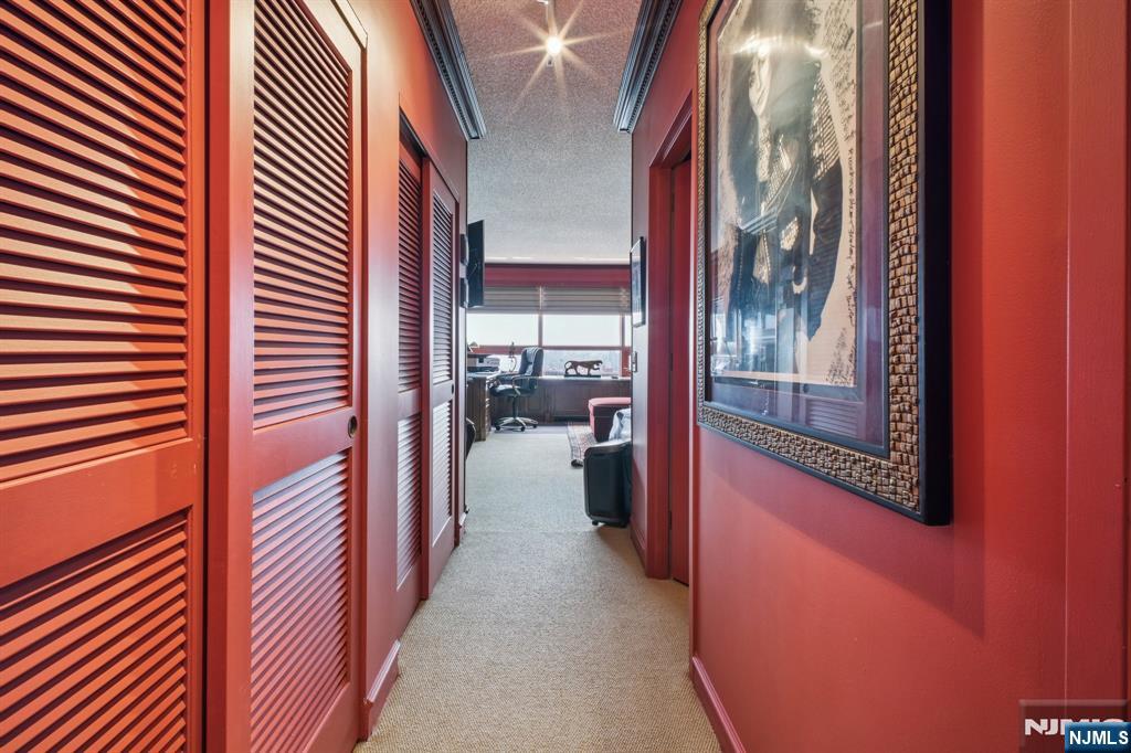 800 Palisade Avenue, Unit PH21A Fort Lee, NJ 07024 - Photo 29 of 50 a view of a hallway with a couch