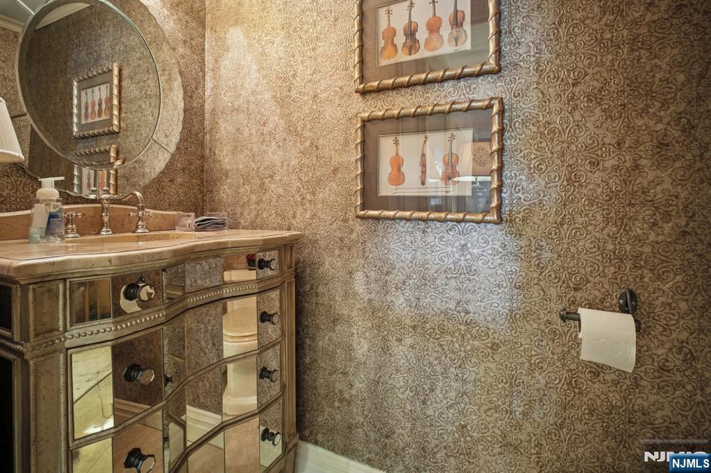 800 Palisade Avenue, Unit PH21A Fort Lee, NJ 07024 - Photo 38 of 50 a bathroom with a sink a mirror and a shower