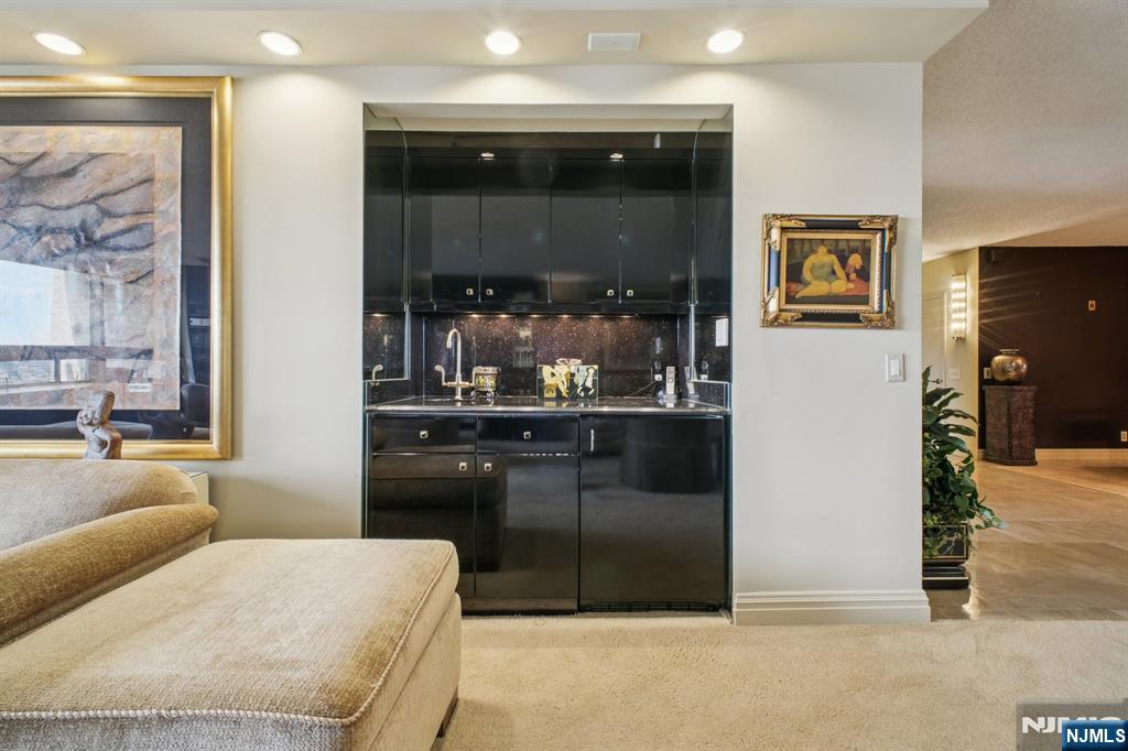 800 Palisade Avenue, Unit PH21A Fort Lee, NJ 07024 - Photo 6 of 50 a bedroom with a bed and glass window