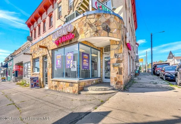 a view of a building with a sign on the wall