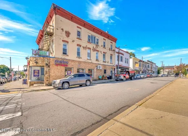 a view of a street with cars
