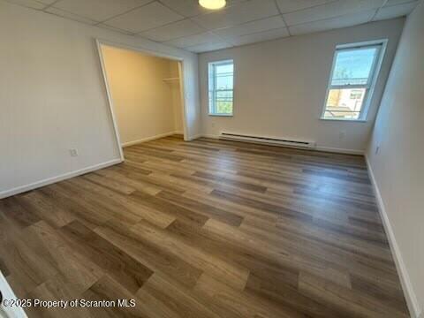 1103 Jackson Street, Unit 3 Scranton, PA 18504 - Photo 6 of 20 an empty room with wooden floor and windows