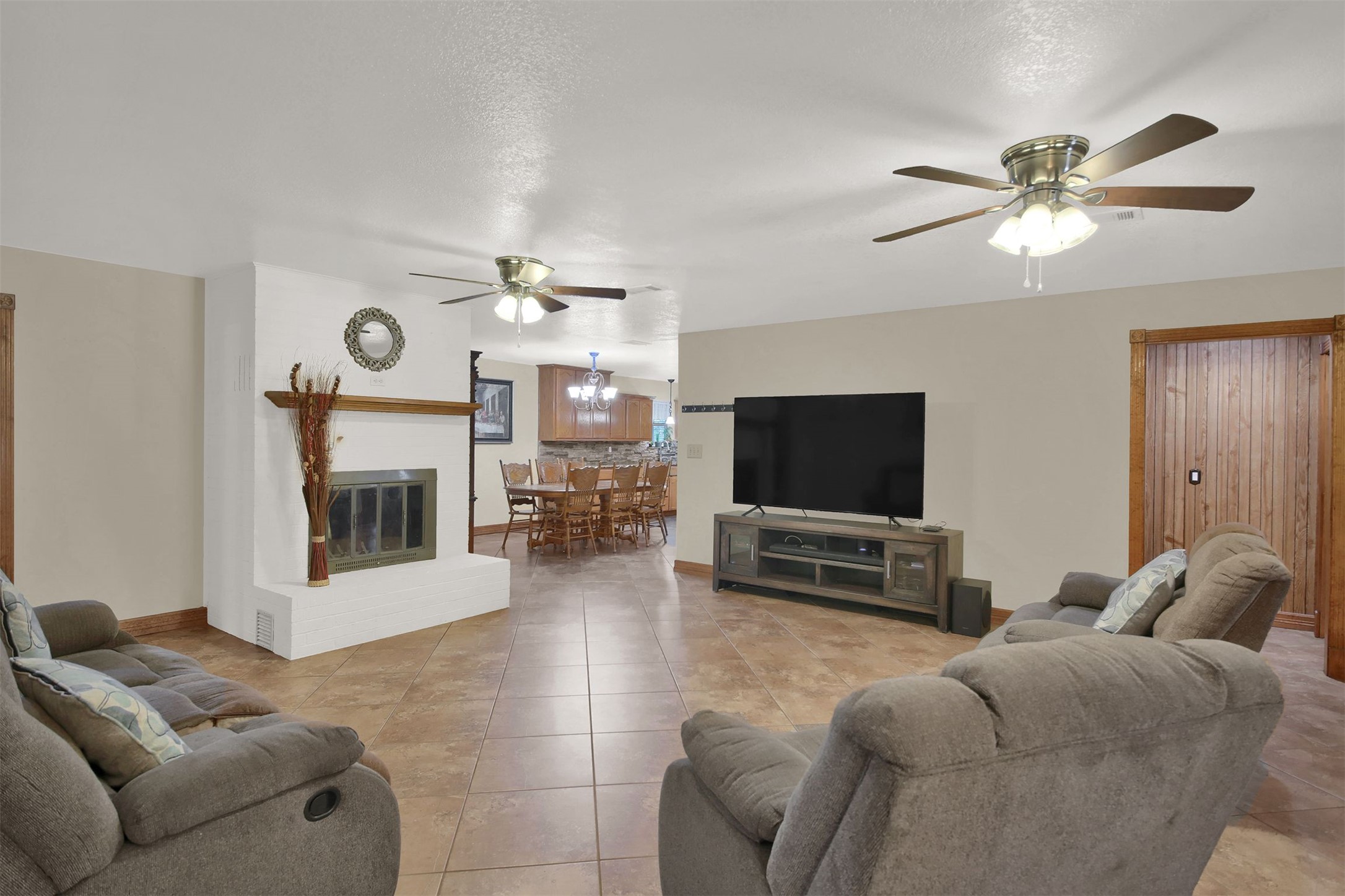 191 Jordan Lane Elgin, TX 78621 - Photo 29 of 29 An inviting open floorplan flows seamlessly from the fireplace-anchored living area to the dining room.
