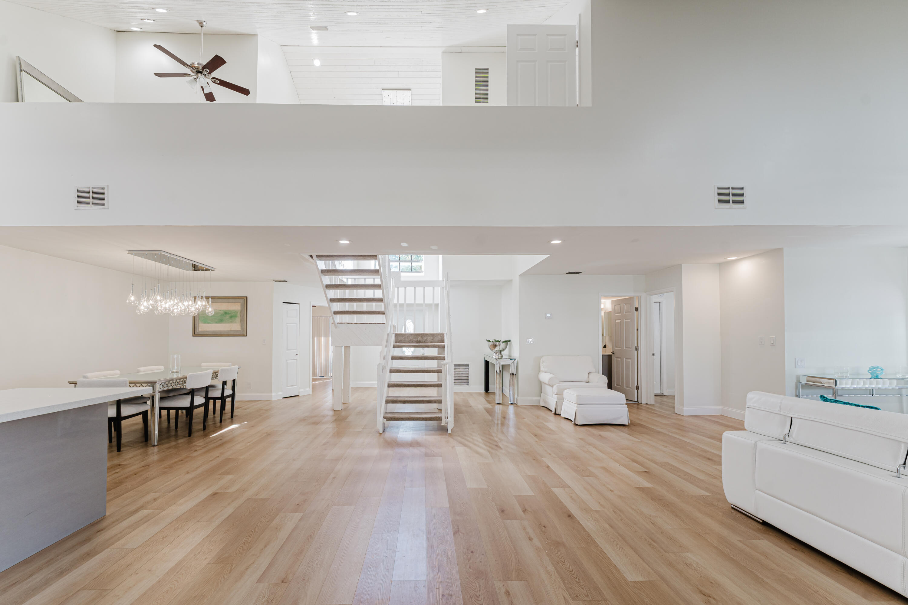 665 Jeffery Street Boca Raton, FL 33487 - Photo 12 of 44 a view of a kitchen with furniture and wooden floor