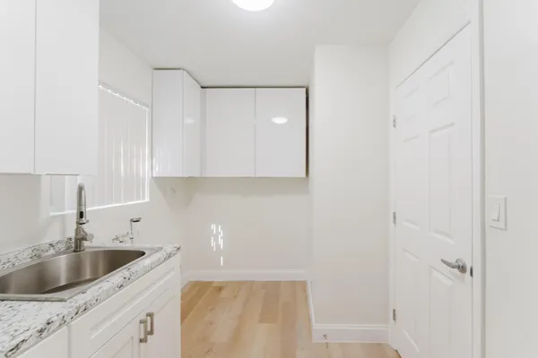 a kitchen with a sink and cabinets