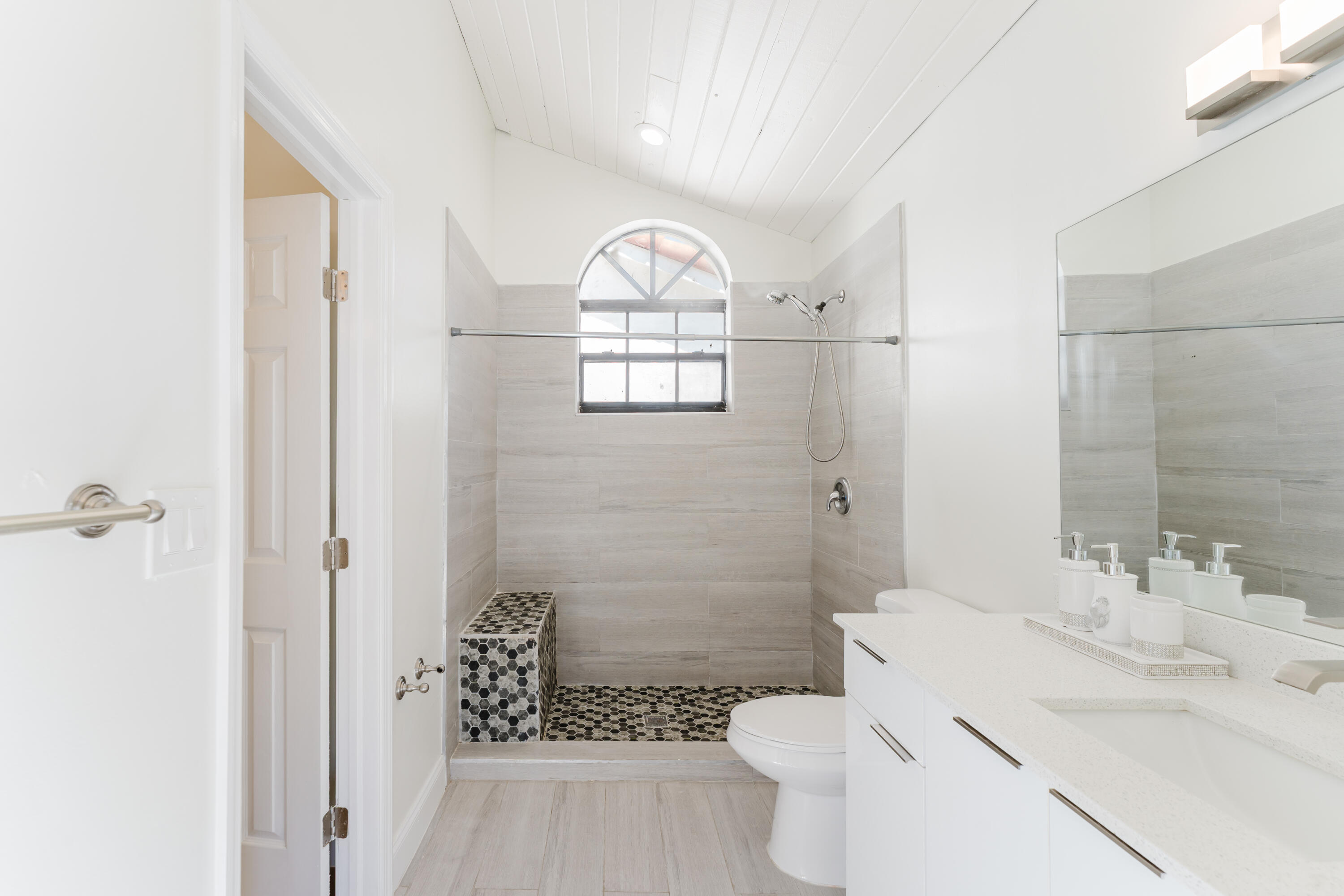 665 Jeffery Street Boca Raton, FL 33487 - Photo 35 of 44 a bathroom with a sink a toilet and shower
