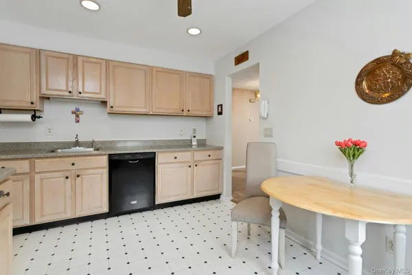 a kitchen with a sink cabinets and appliances