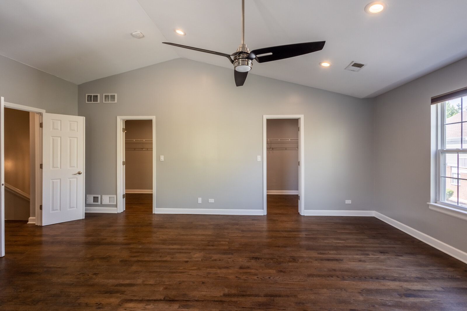 1244 Georgetown Way Vernon Hills, IL 60061 - Photo 12 of 17 a view of an empty room with wooden floor and a window