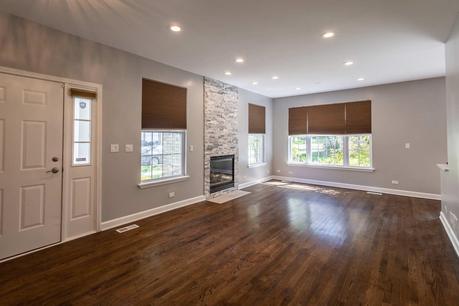 1244 Georgetown Way Vernon Hills, IL 60061 - Photo 3 of 17 an empty room with wooden floor and windows