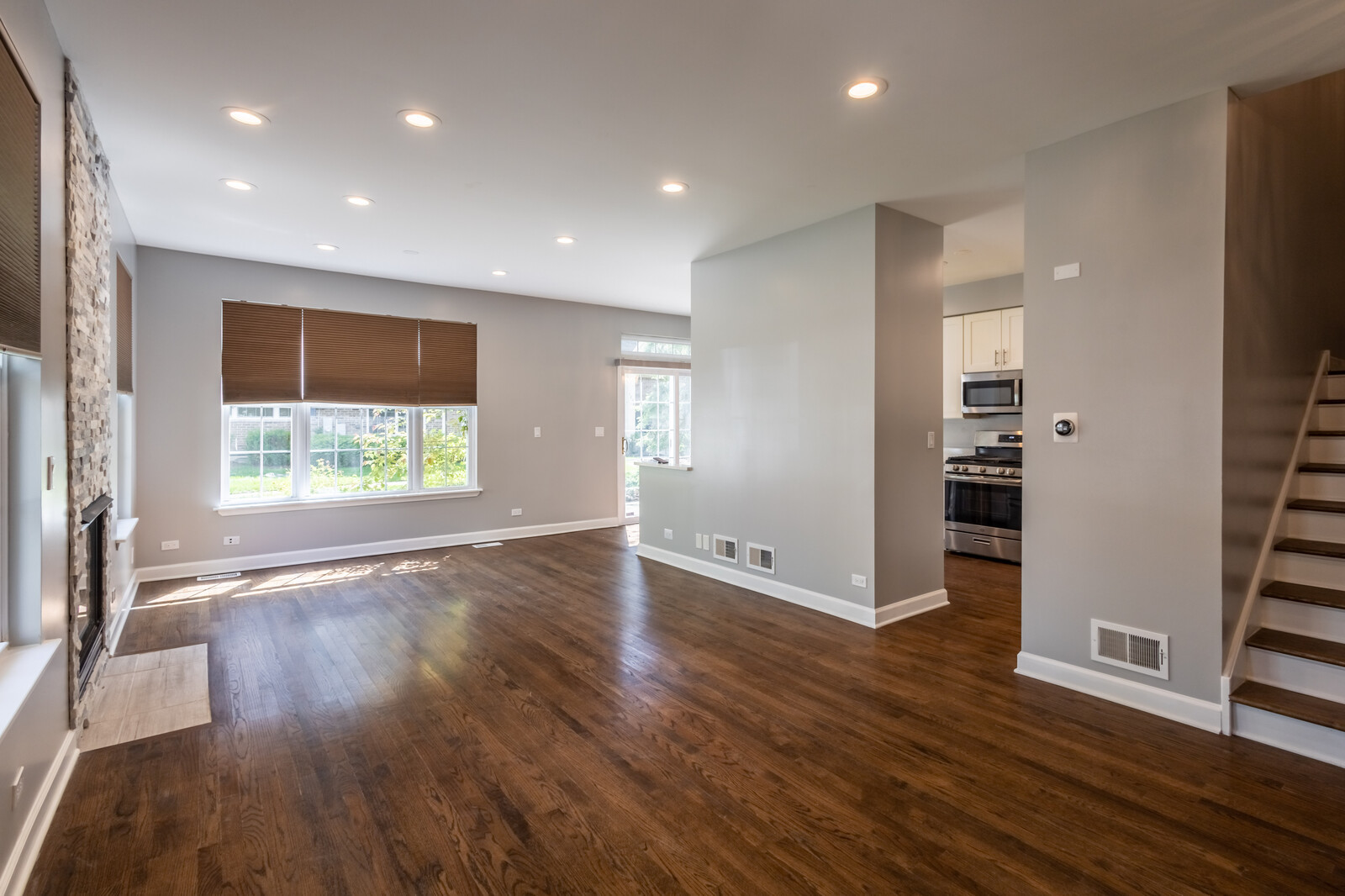 1244 Georgetown Way Vernon Hills, IL 60061 - Photo 4 of 17 an empty room with wooden floor and windows