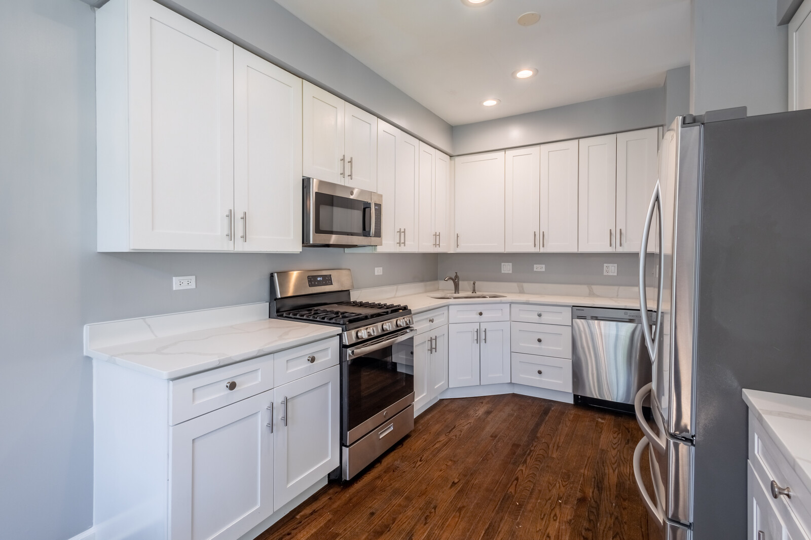 1244 Georgetown Way Vernon Hills, IL 60061 - Photo 6 of 17 a kitchen with granite countertop white cabinets and stainless steel appliances