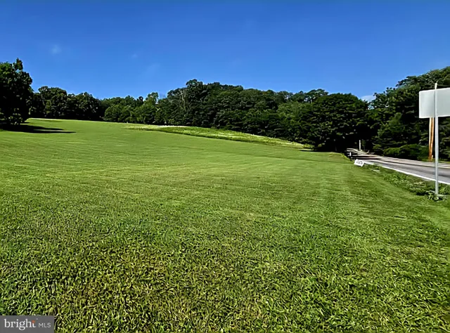 a view of a golf course with a lake view