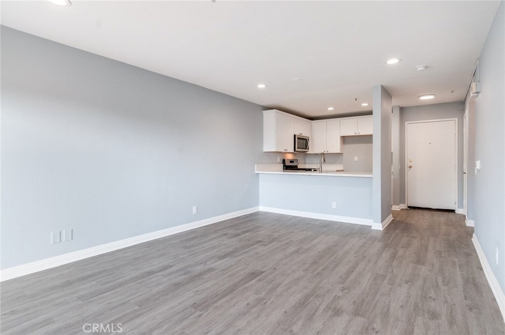 450 East 4th Street, Unit 221 Santa Ana, CA 92701 - Photo 11 of 43 a view of kitchen with wooden floor