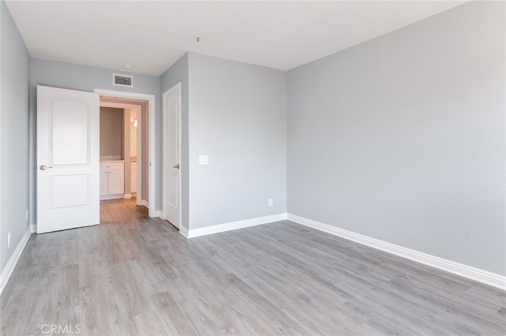 450 East 4th Street, Unit 221 Santa Ana, CA 92701 - Photo 17 of 43 a view of an empty room with wooden floor