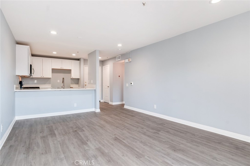450 East 4th Street, Unit 221 Santa Ana, CA 92701 - Photo 2 of 43 a view of kitchen with wooden floor