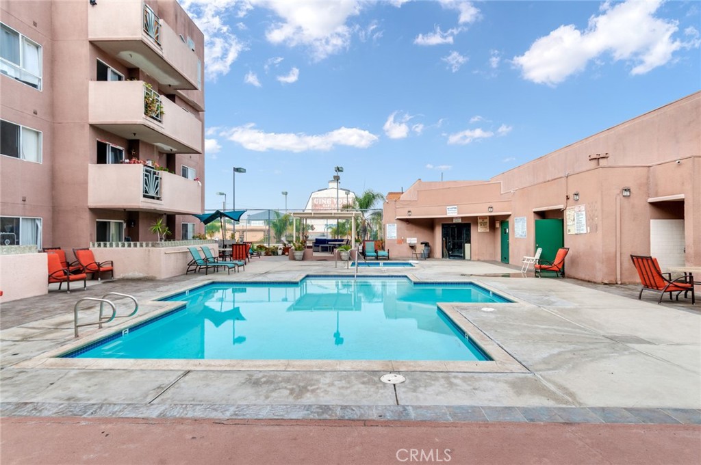 450 East 4th Street, Unit 221 Santa Ana, CA 92701 - Photo 25 of 43 a view of a white house with swimming pool