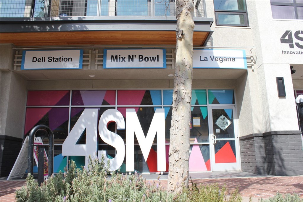 450 East 4th Street, Unit 221 Santa Ana, CA 92701 - Photo 38 of 43 a front view of building with sign board