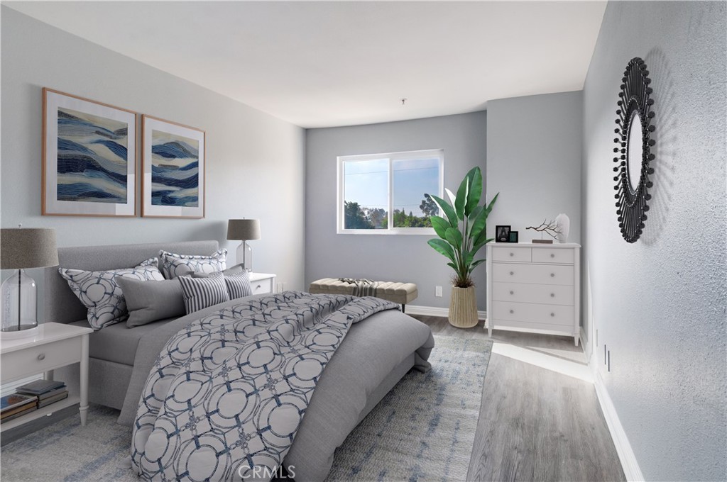 450 East 4th Street, Unit 221 Santa Ana, CA 92701 - Photo 5 of 43 a bedroom with a bed and a couch