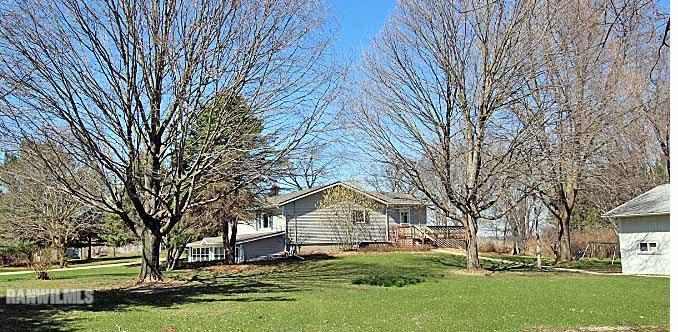 8130 East River Road Ridott, IL 61067 - Photo 3 of 25 front view of a house with a yard