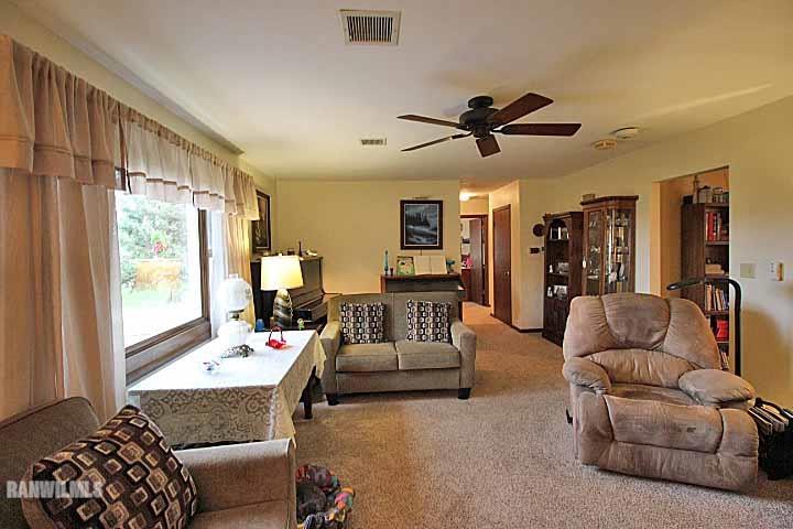 8130 East River Road Ridott, IL 61067 - Photo 9 of 25 a living room with furniture and a large window