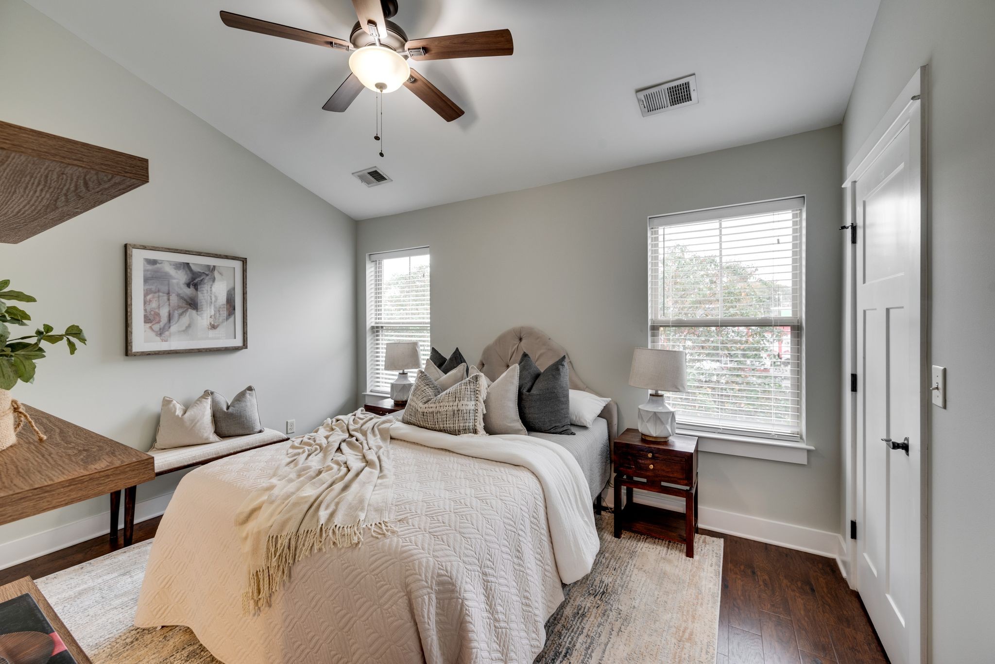 1106 Stratford Avenue, Unit 3 Nashville, TN 37216 - Photo 13 of 23 a bedroom with a bed and a chandelier