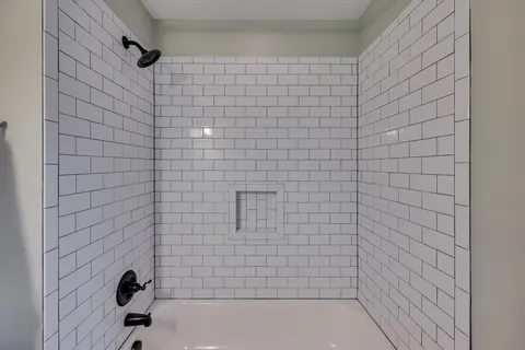 a view of a bedroom with washer and dryer