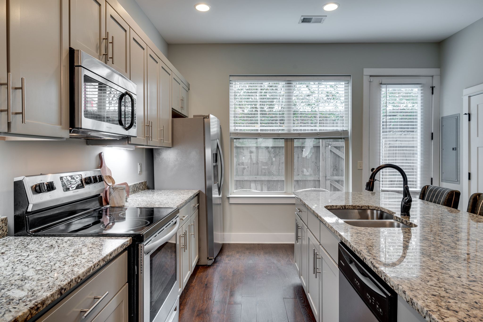 1106 Stratford Avenue, Unit 3 Nashville, TN 37216 - Photo 9 of 23 a kitchen with stainless steel appliances granite countertop a sink stove and refrigerator