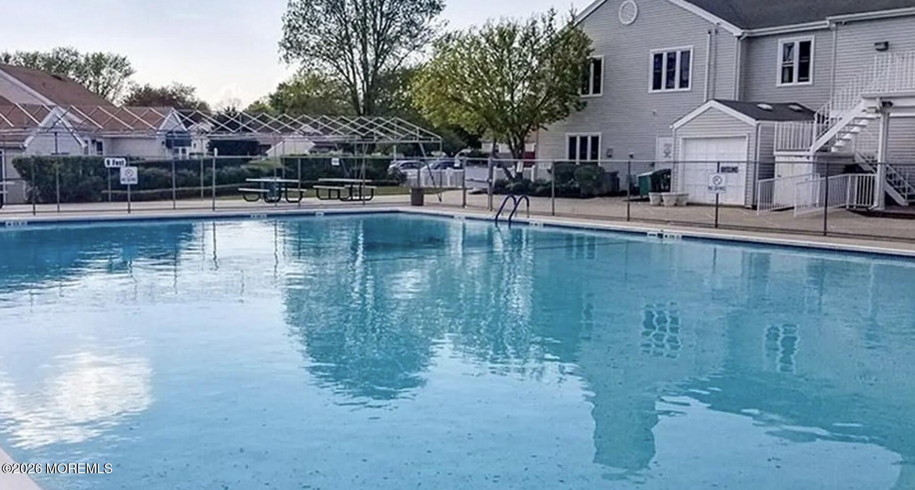 139 Wein Market, Unit F Freehold, NJ 07728 - Photo 24 of 26 a view of a lake with house