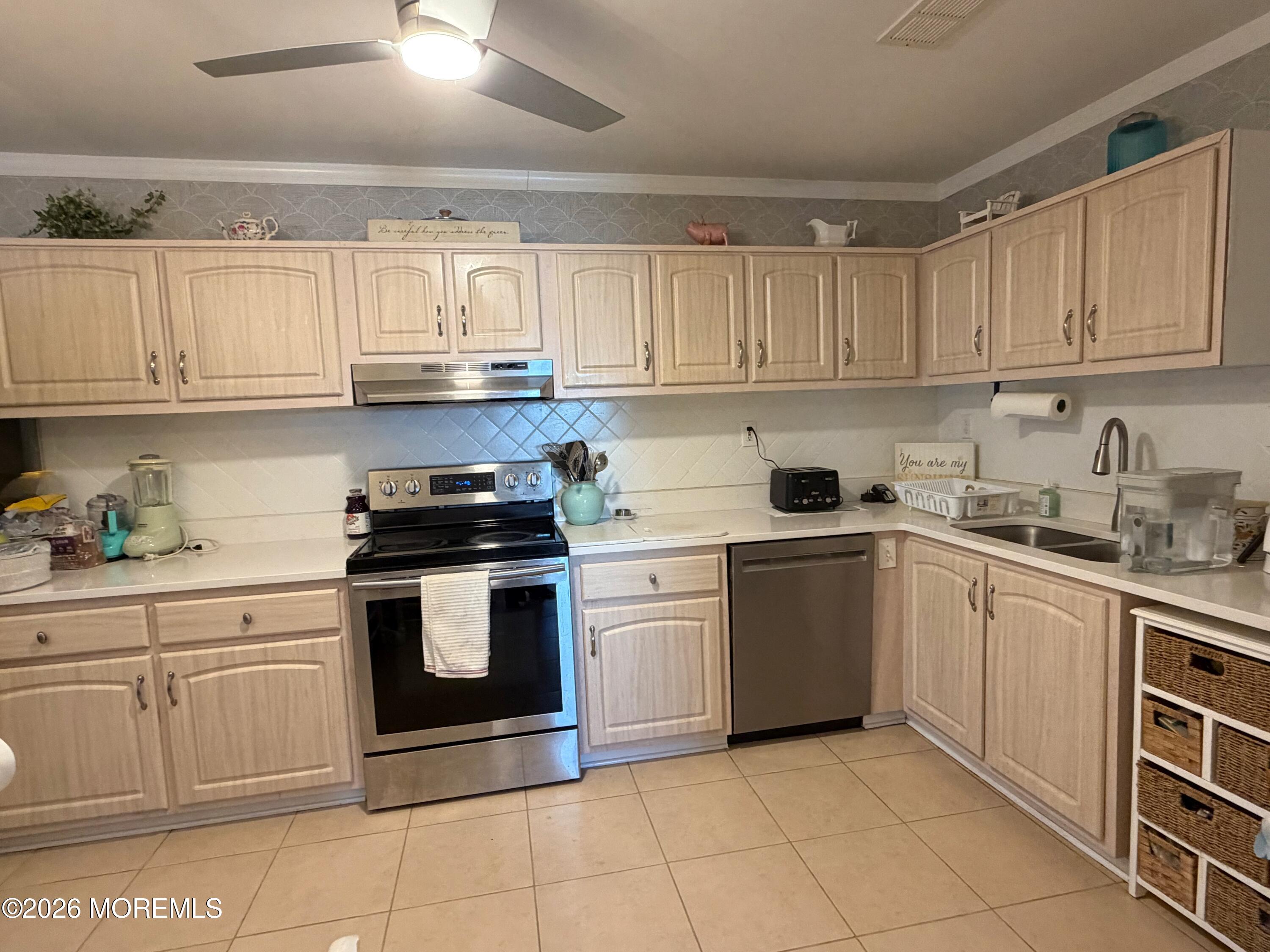 139 Wein Market, Unit F Freehold, NJ 07728 - Photo 9 of 26 a kitchen with granite countertop white cabinets and appliances