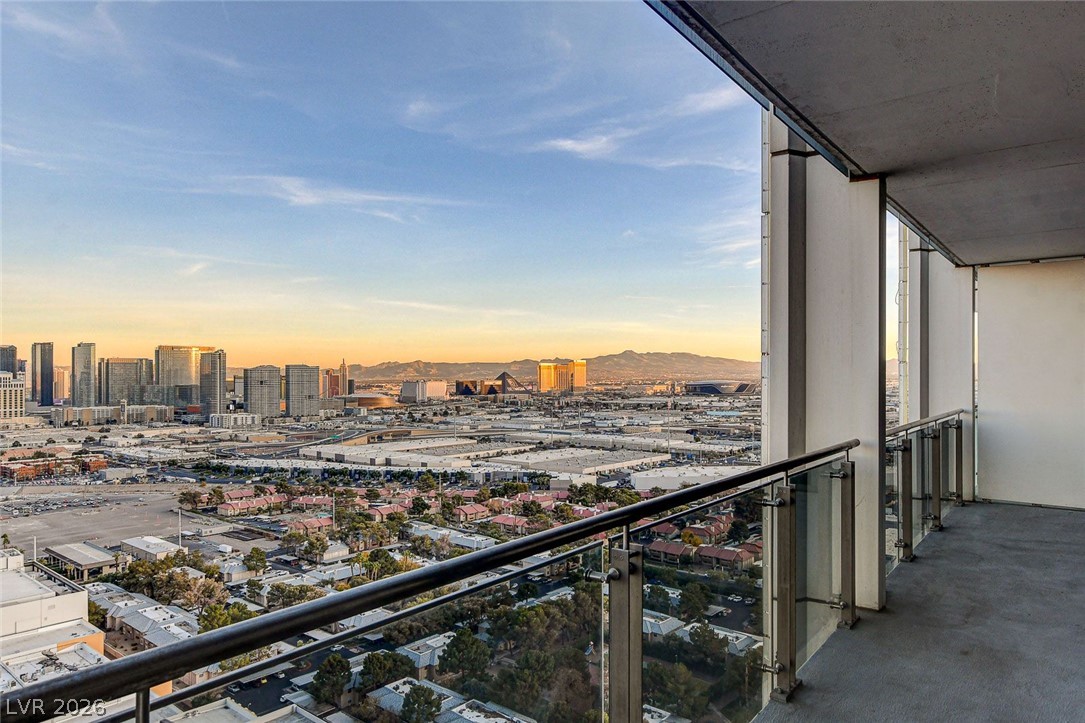 4381 West Flamingo Road, Unit 3002 Las Vegas, NV 89103 - Photo 25 of 59 Panoramas of the city skyline and distant mountains unfurl from this covered high-rise balcony.