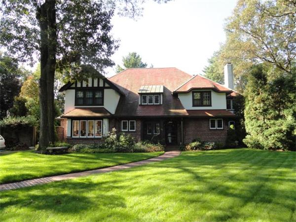 104 Crofton Road Newton, MA 02468 - Photo 1 of 30 a front view of a house with garden and trees