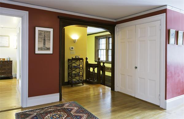 104 Crofton Road Newton, MA 02468 - Photo 12 of 30 a view of a hallway with wooden floor and a couch