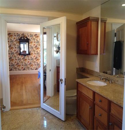 104 Crofton Road Newton, MA 02468 - Photo 27 of 30 a bathroom with a granite countertop sink a mirror and a shower