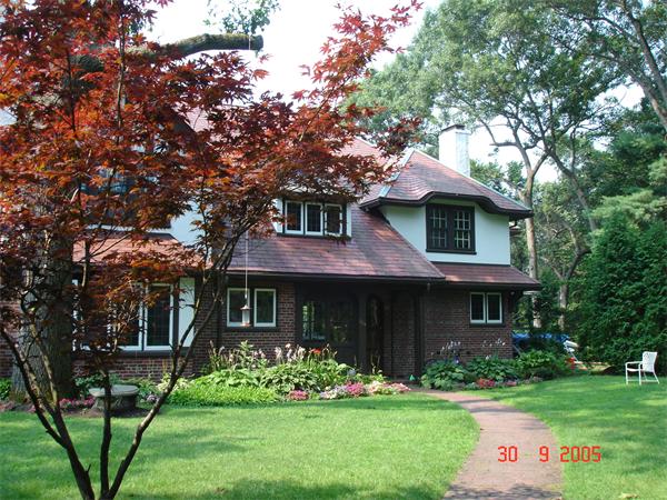 104 Crofton Road Newton, MA 02468 - Photo 30 of 30 a front view of a house with a garden and plants
