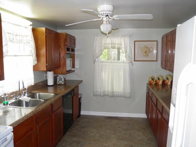 2774 Cole Ridge Road Beechgrove, TN 37018 - Photo 5 of 20 Kitchen features oak cabinetry, stainless sink, window over the sink and a large extra window for lots of natural light to enjoy your coffee.