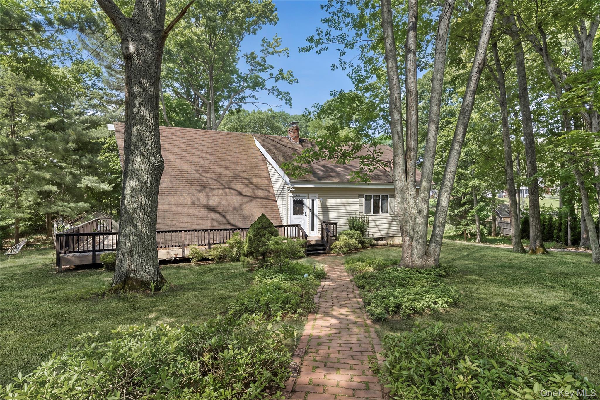 600 Highwood Road Southold, NY 11971 - Photo 2 of 14 Front of ResidenceEnhanced with Summertime Greenery
