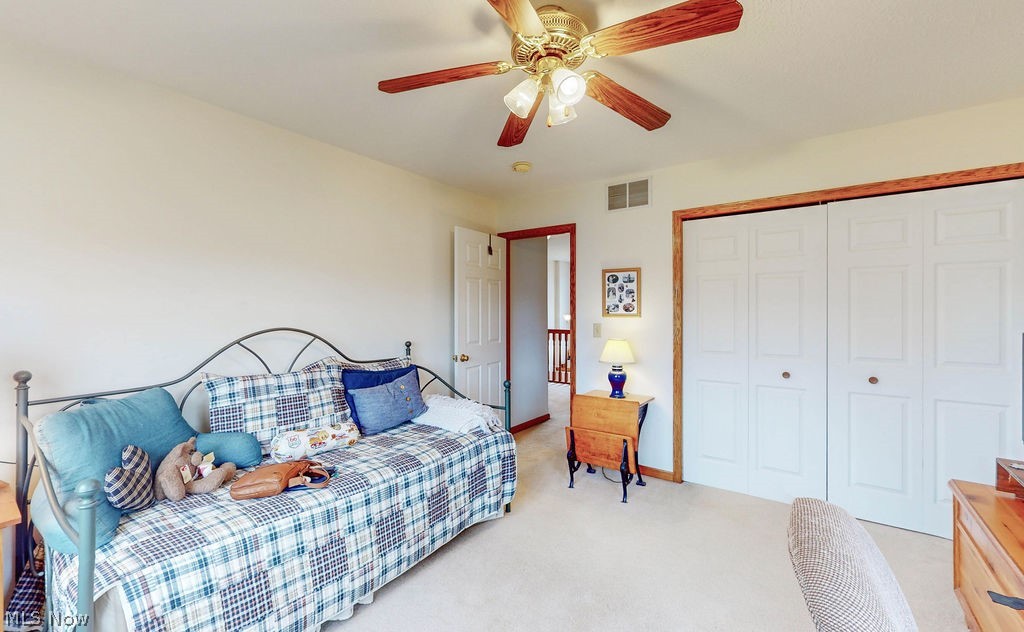 10147 Page Road Streetsboro, OH 44241 - Photo 27 of 35 Carpeted living room with ceiling fan