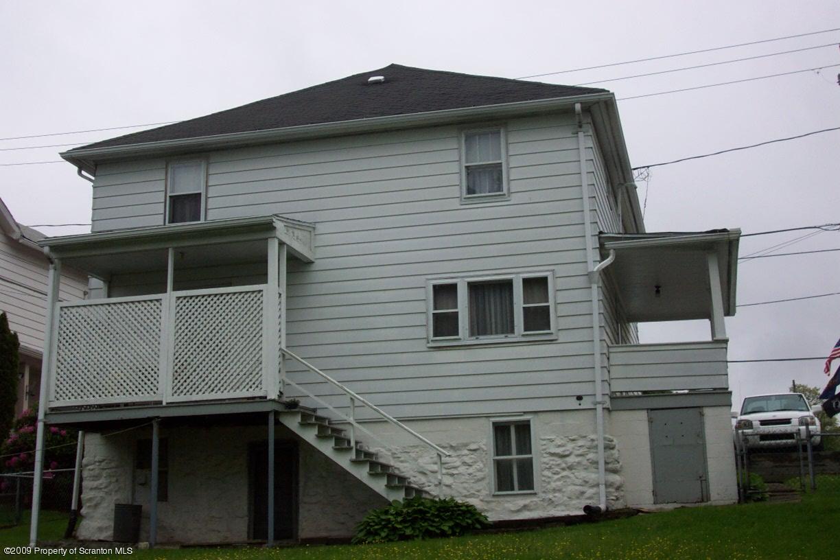 45 Main Street Inkerman, PA 18640 - Photo 2 of 2 a front view of a house with a garden