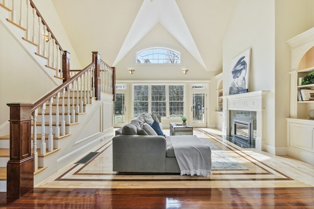 19 Whippoorwill Lane Concord, MA 01742 - Photo 12 of 33 a living room with fireplace furniture and a wooden floor