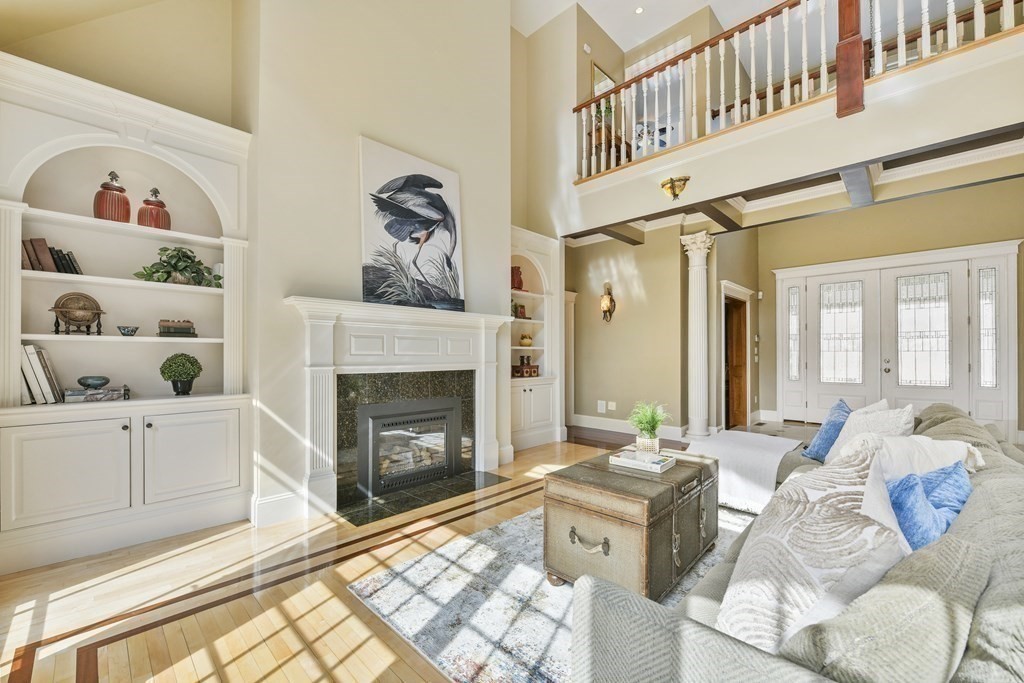 19 Whippoorwill Lane Concord, MA 01742 - Photo 14 of 33 a living room with furniture and a fireplace