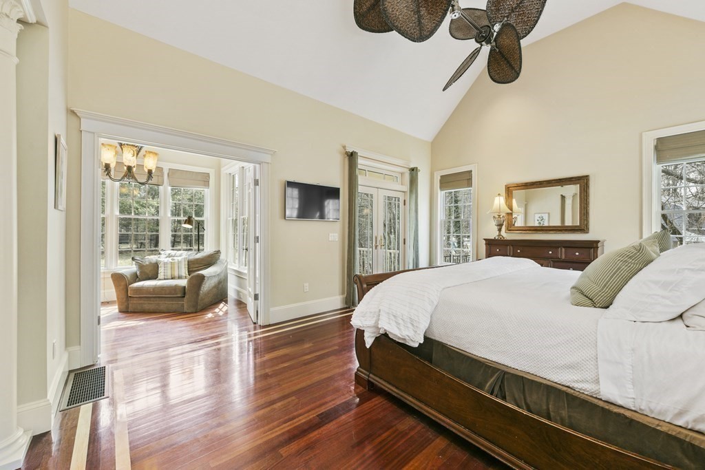 19 Whippoorwill Lane Concord, MA 01742 - Photo 17 of 33 a bed room with a bed and a couch