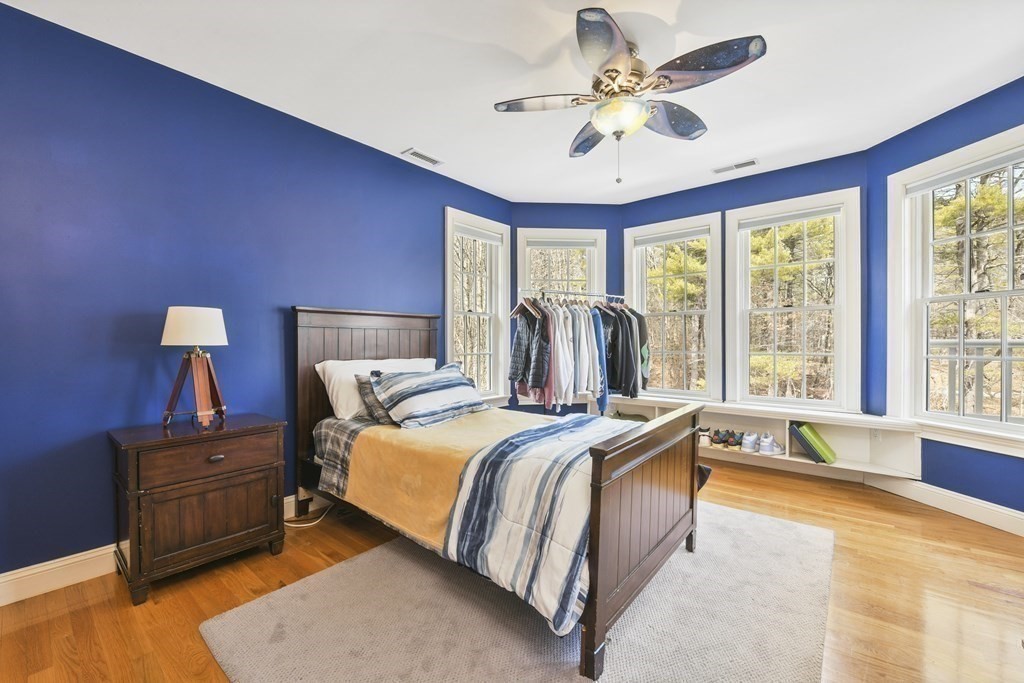 19 Whippoorwill Lane Concord, MA 01742 - Photo 20 of 33 a bed room with a bed and a large window