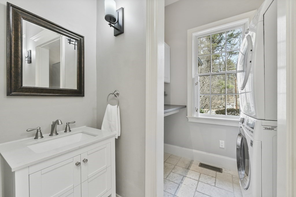 19 Whippoorwill Lane Concord, MA 01742 - Photo 25 of 33 a bathroom with a sink a toilet and a mirror