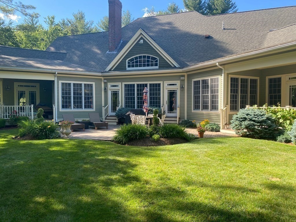 19 Whippoorwill Lane Concord, MA 01742 - Photo 26 of 33 a front view of a house with swimming pool and porch