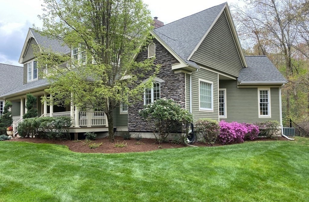 19 Whippoorwill Lane Concord, MA 01742 - Photo 3 of 33 a front view of a house with garden