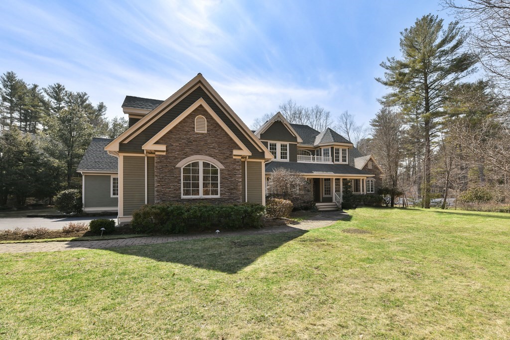 19 Whippoorwill Lane Concord, MA 01742 - Photo 32 of 33 a front view of a house with a yard and trees