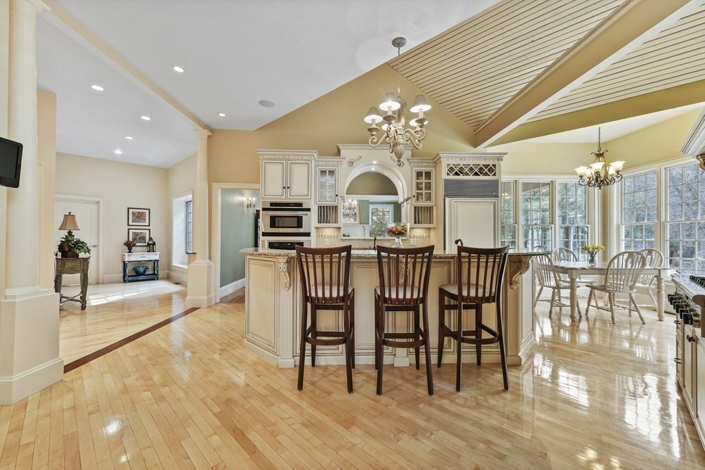 19 Whippoorwill Lane Concord, MA 01742 - Photo 5 of 33 a view of a dining room and livingroom with furniture wooden floor a chandelier