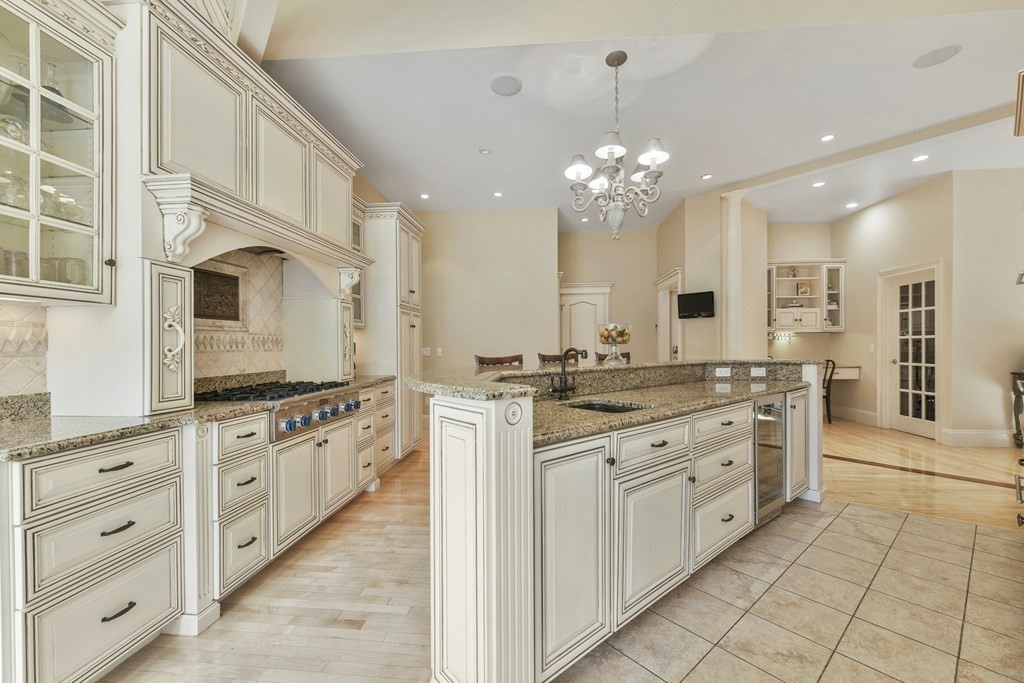 19 Whippoorwill Lane Concord, MA 01742 - Photo 7 of 33 a kitchen with stainless steel appliances granite countertop a stove and a sink